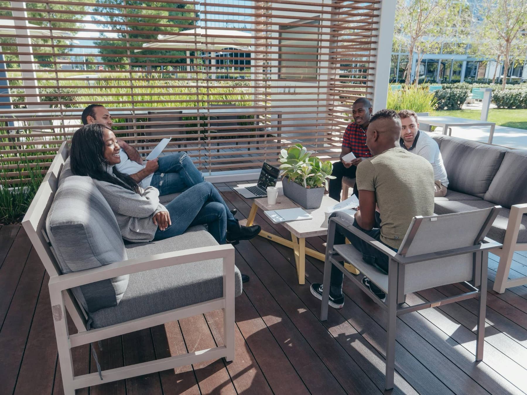An executive team in a relaxed off-site working session